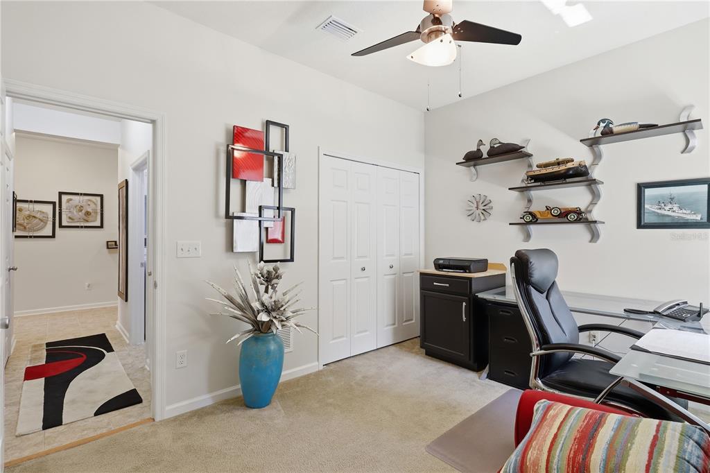 124 South Hummingbird Place Palm Coast, FL 32164 - Photo 23 of 47 a view of a workspace with furniture and a window