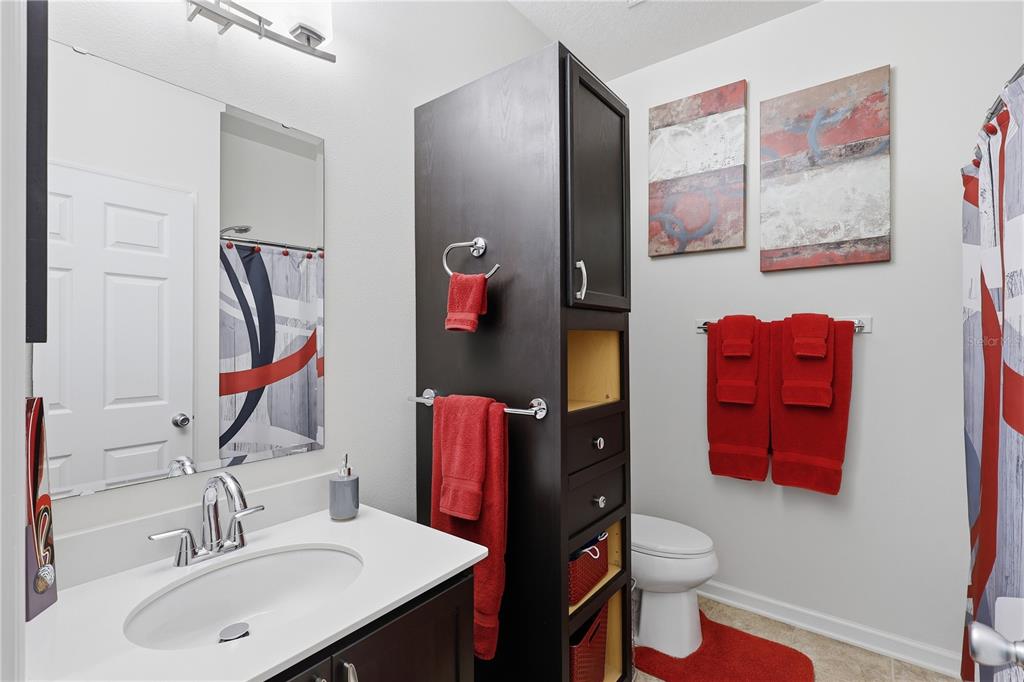 124 South Hummingbird Place Palm Coast, FL 32164 - Photo 24 of 47 a bathroom with a sink vanity and mirror