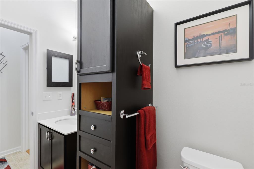 124 South Hummingbird Place Palm Coast, FL 32164 - Photo 25 of 47 a bathroom with a toilet sink and mirror