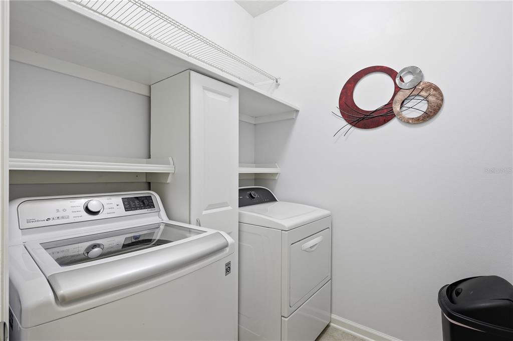 124 South Hummingbird Place Palm Coast, FL 32164 - Photo 26 of 47 a utility room with dryer and washer