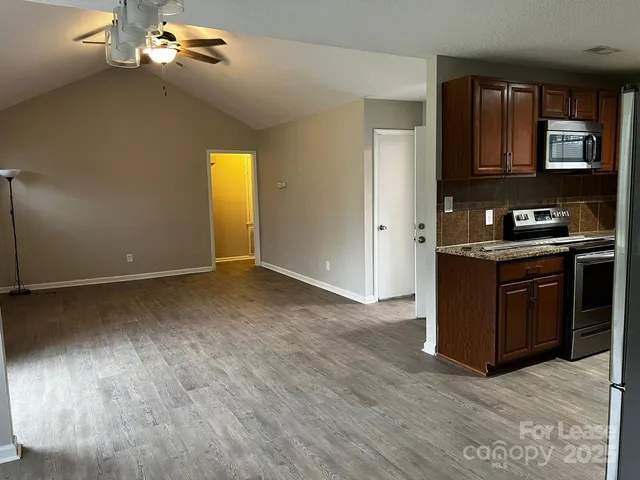 a view of a livingroom with wooden floor