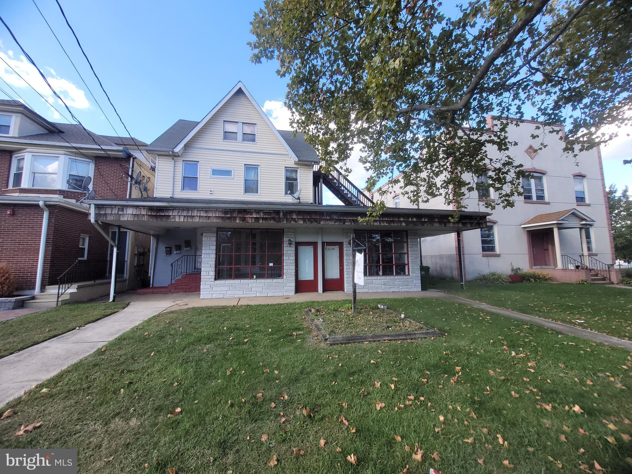 2 East Broad Street, Unit 2 Palmyra, NJ 08065 - Photo 14 of 15 a front view of a house with a garden
