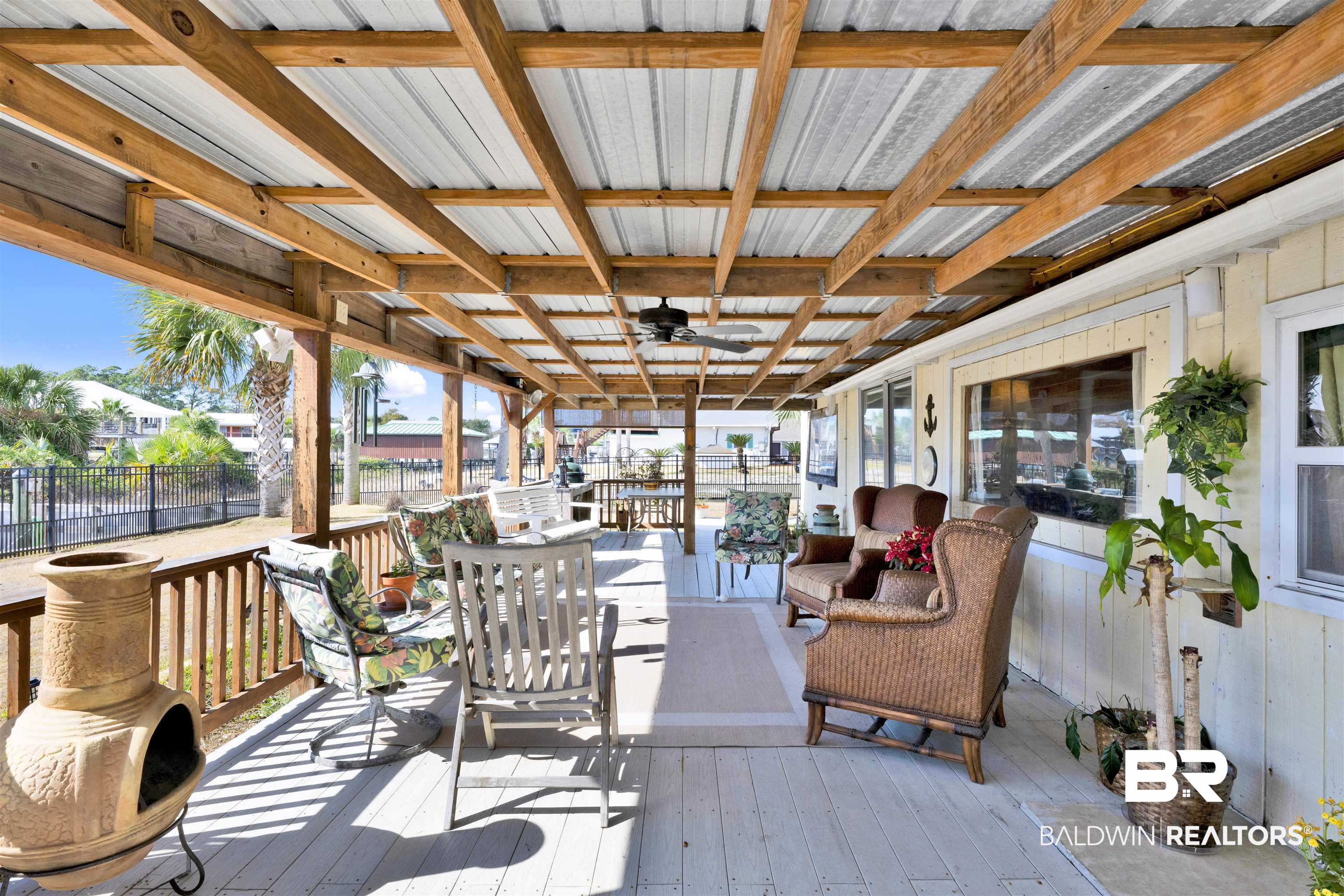 26222 Marina Road Orange Beach, AL 36561 - Photo 34 of 38 Wooden deck featuring an outdoor hangout area and a ceiling fan