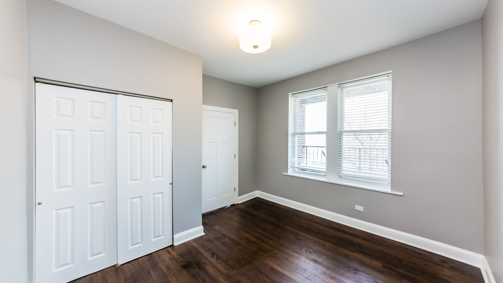 3903 West Belden Avenue, Unit 2 Chicago, IL 60647 - Photo 12 of 15 wooden floor in an empty room with a window