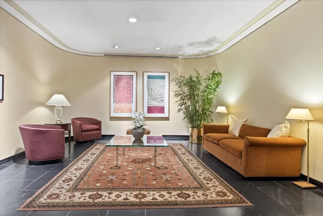 a living room with furniture and a rug