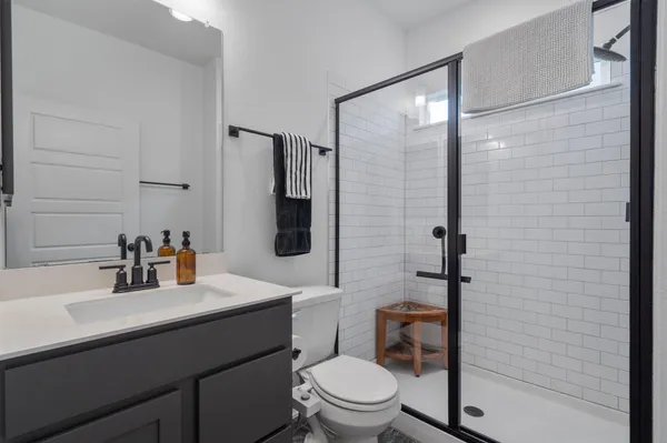 a bedroom with furniture and window