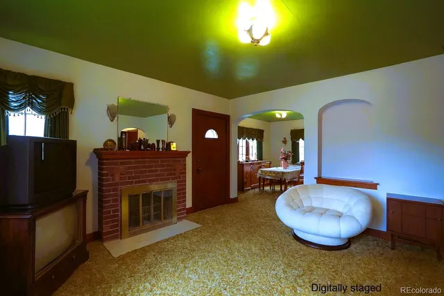 a dining room with furniture and a fireplace