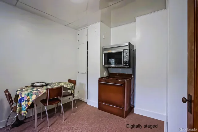 a view of kitchen and refrigerator