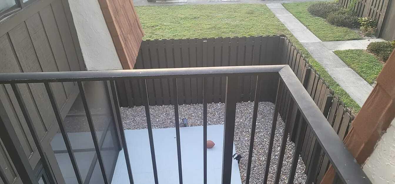 2184 White Pine Circle, Unit A Greenacres, FL 33415 - Photo 11 of 15 a view of balcony with wooden floor