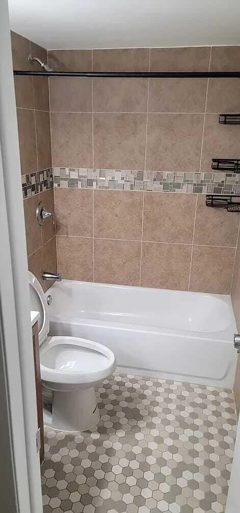 2184 White Pine Circle, Unit A Greenacres, FL 33415 - Photo 13 of 15 a bathroom with a sink toilet and shower