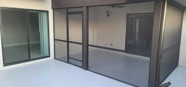 a bathroom with a granite countertop sink a toilet and a mirror