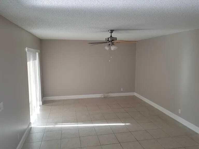 2184 White Pine Circle, Unit A Greenacres, FL 33415 - Photo 5 of 15 a view of a small space with wooden floor