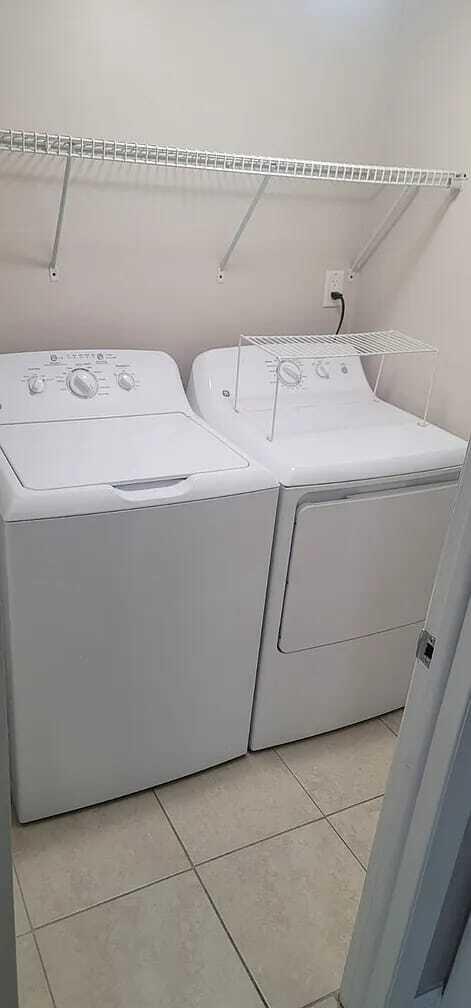 2184 White Pine Circle, Unit A Greenacres, FL 33415 - Photo 7 of 15 a utility room with dryer and washer