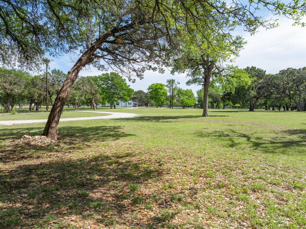 2731 Garrett Lane China Spring, TX 76633 - Photo 12 of 36 a view of a field with trees in the background