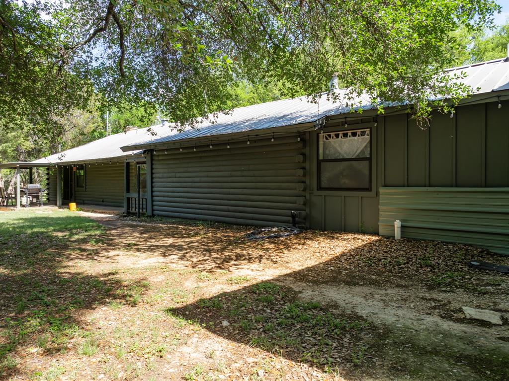 2731 Garrett Lane China Spring, TX 76633 - Photo 14 of 36 a view of a house with a yard tree and wooden fence