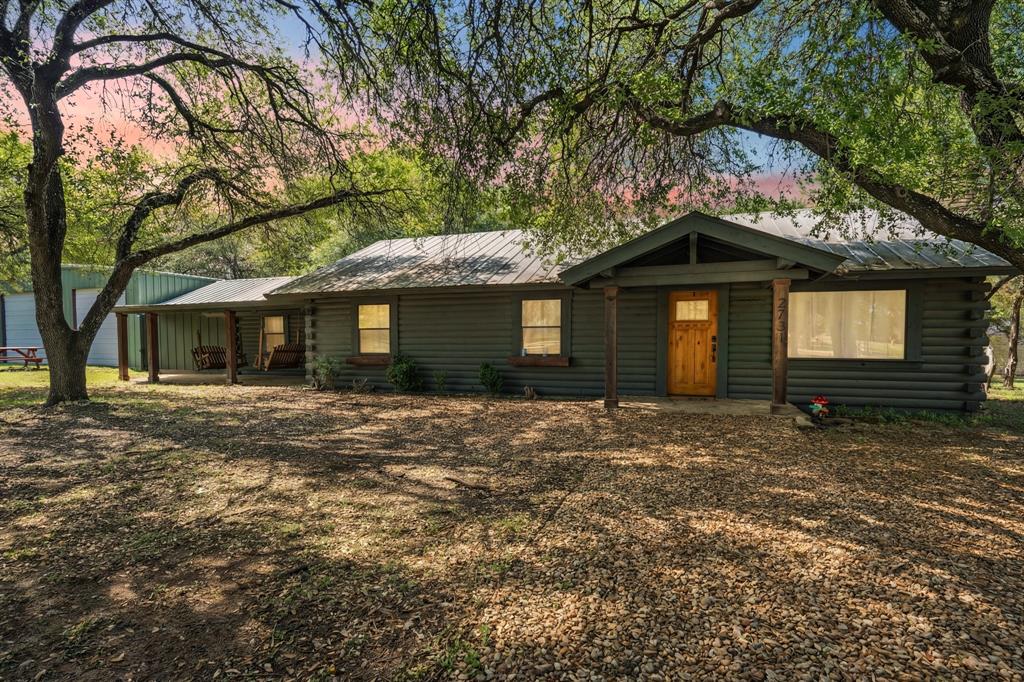 2731 Garrett Lane China Spring, TX 76633 - Photo 2 of 36 a front view of a house with a garden