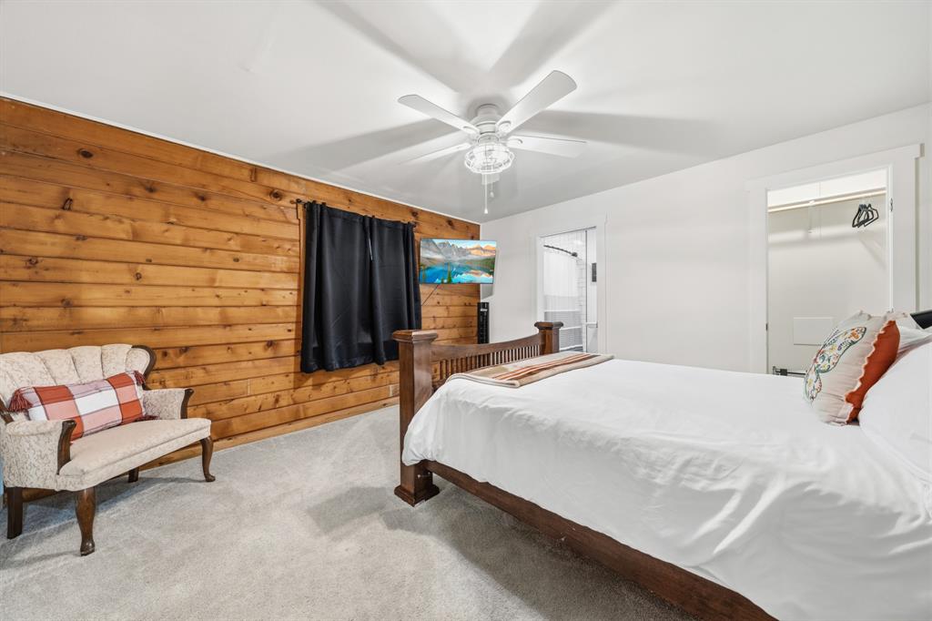 2731 Garrett Lane China Spring, TX 76633 - Photo 31 of 36 a bed room with a bed and a chandelier