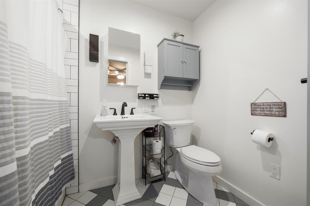 2731 Garrett Lane China Spring, TX 76633 - Photo 33 of 36 a bathroom with a toilet a sink and mirror