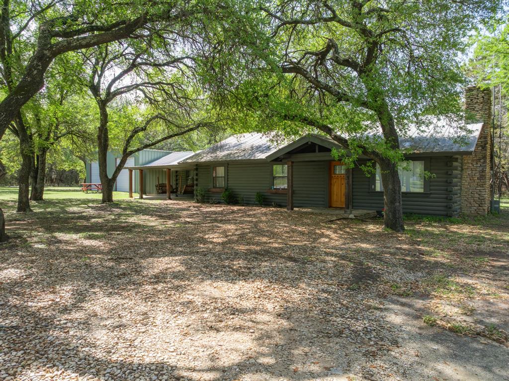2731 Garrett Lane China Spring, TX 76633 - Photo 4 of 36 a front view of a house with a garden