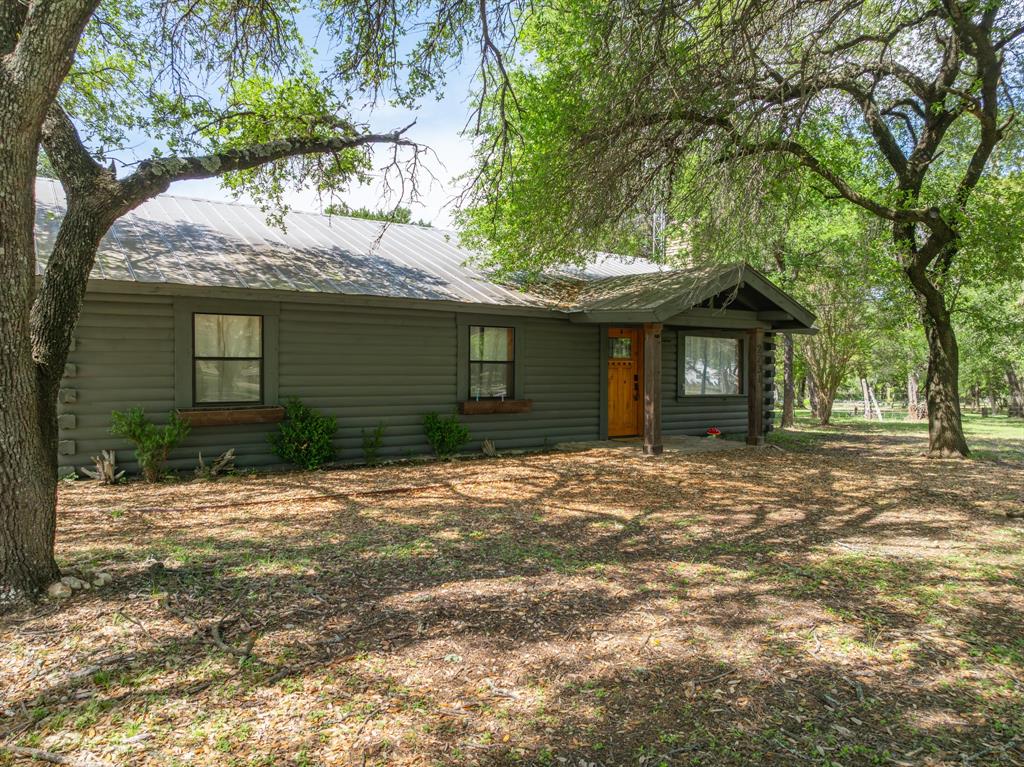 2731 Garrett Lane China Spring, TX 76633 - Photo 5 of 36 a front view of a house with a garden