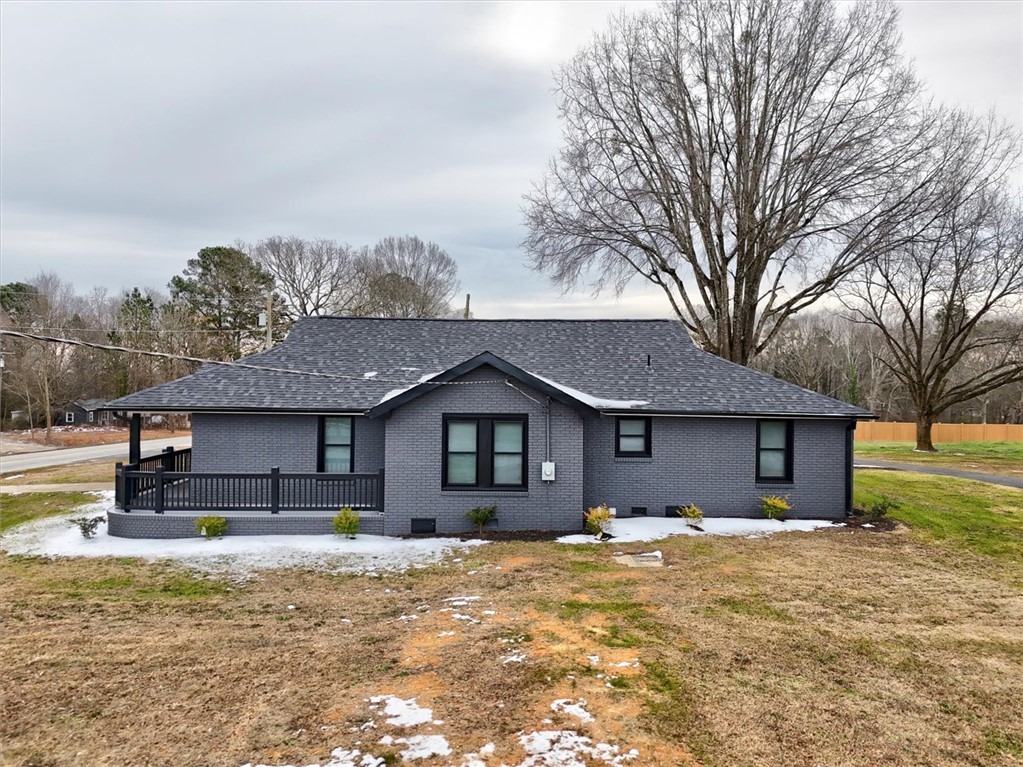 801 Cherokee Road Pelzer, SC 29669 - Photo 6 of 45 This charming residence features a well-maintained exterior and a welcoming covered porch.