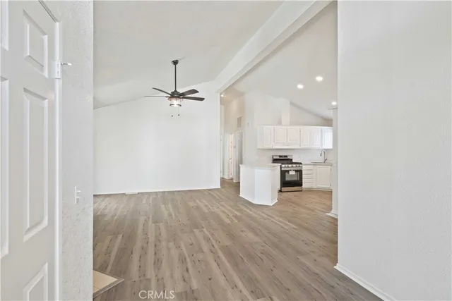 a view of a kitchen with wooden floor