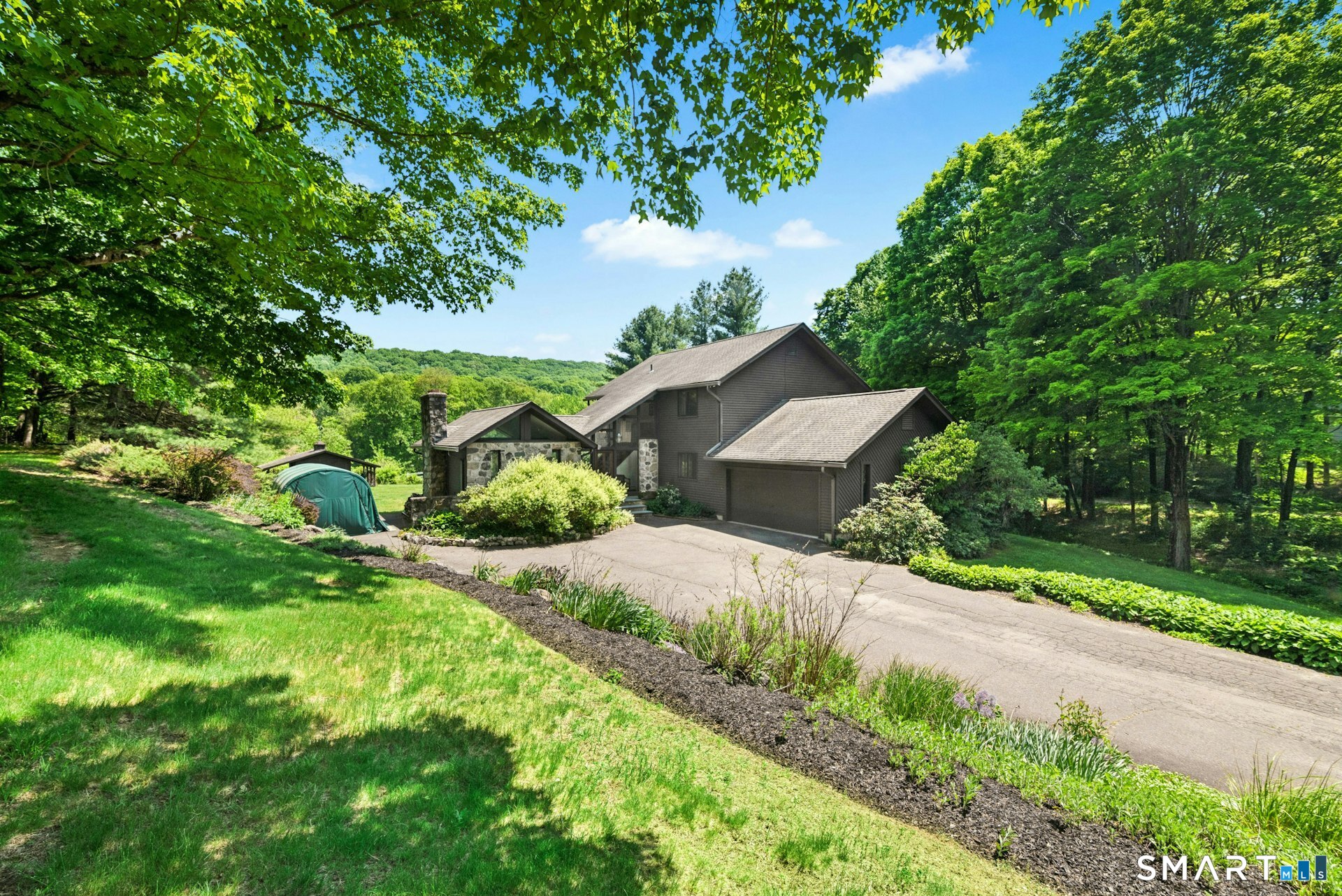 127 Huntingtown Road Newtown, CT 06470 - Photo 3 of 38 a view of a house with a yard and large trees