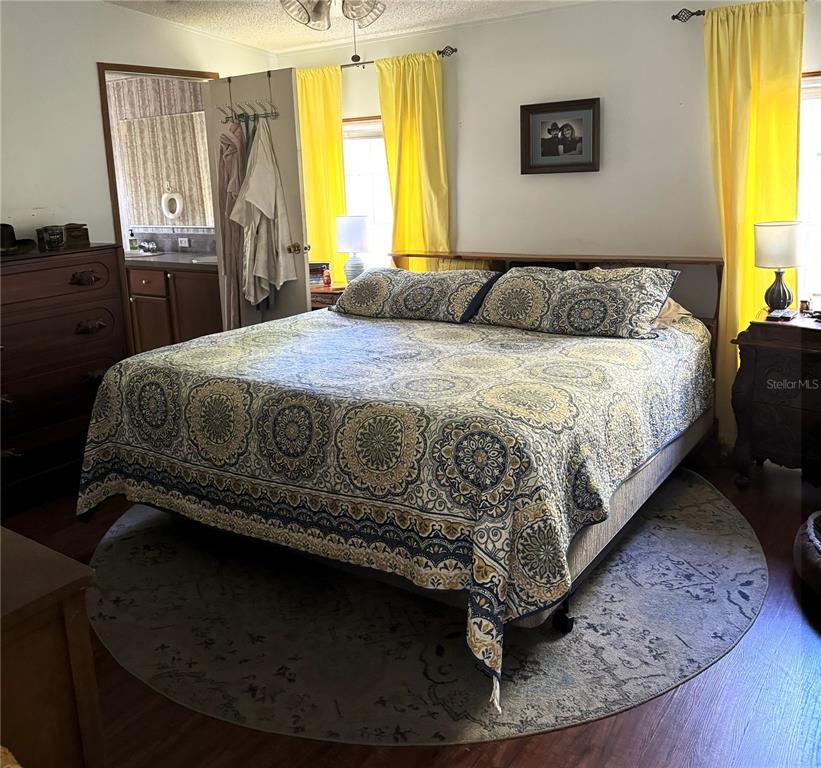 16314 Tiger Trail Spring Hill, FL 34610 - Photo 7 of 11 a bedroom with a bed and window