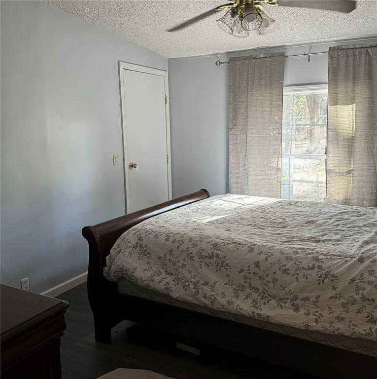 16314 Tiger Trail Spring Hill, FL 34610 - Photo 9 of 11 a bedroom with a bed and a window