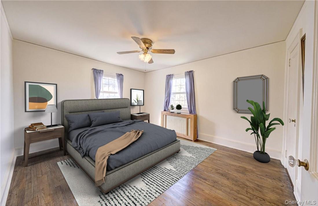 1 Rutgers Place Scarsdale, NY 10583 - Photo 11 of 29 a bedroom with a large bed and a chandelier