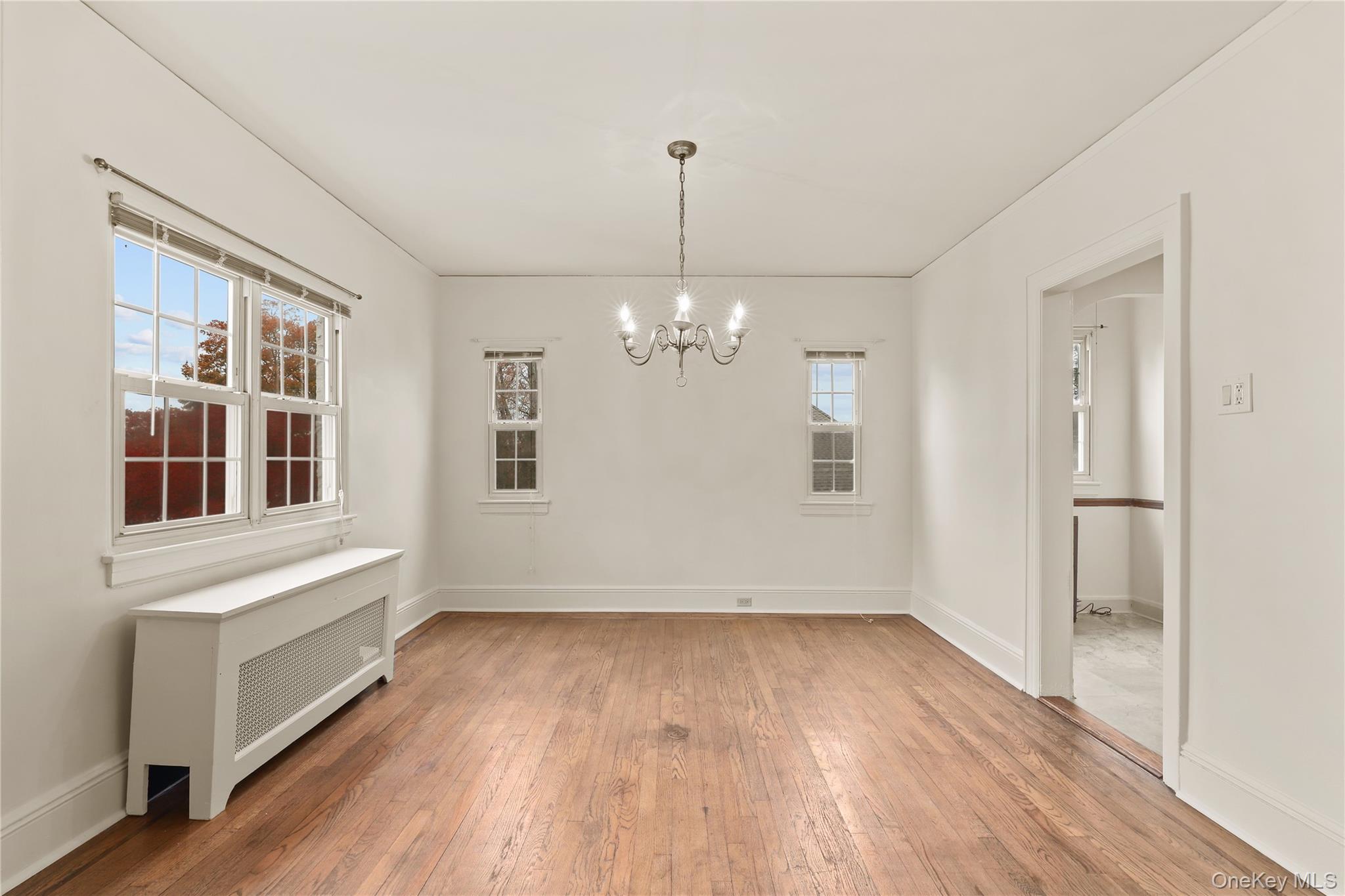 1 Rutgers Place Scarsdale, NY 10583 - Photo 19 of 29 a view of an empty room with wooden floor and a window