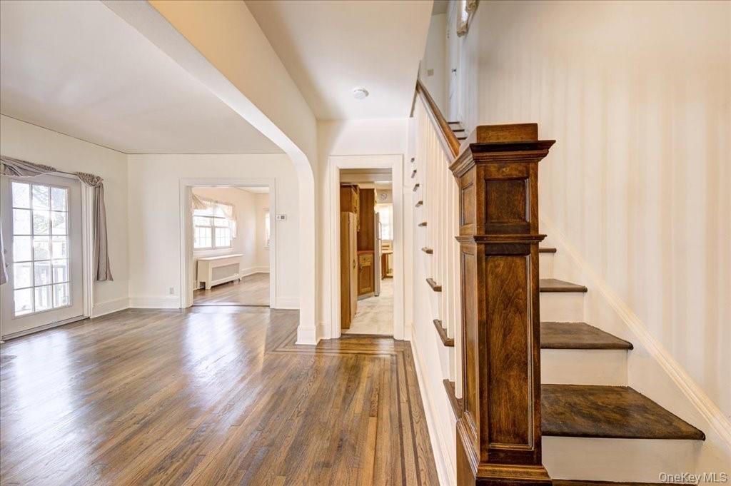 1 Rutgers Place Scarsdale, NY 10583 - Photo 2 of 29 a view of a hallway with wooden floor and staircase