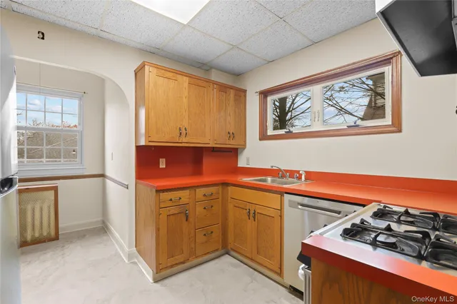 a kitchen with a stove and a sink