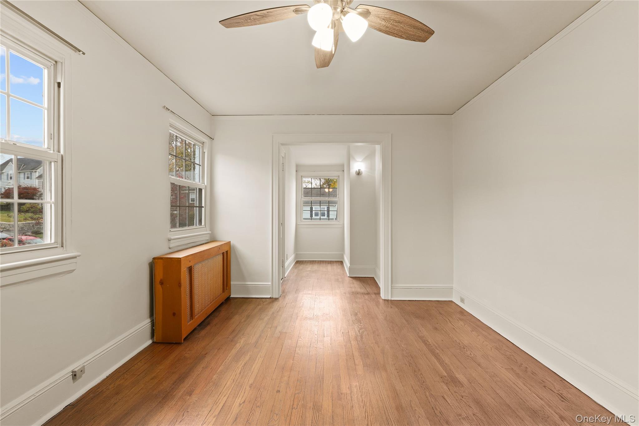 1 Rutgers Place Scarsdale, NY 10583 - Photo 26 of 29 wooden floor in an empty room with a window