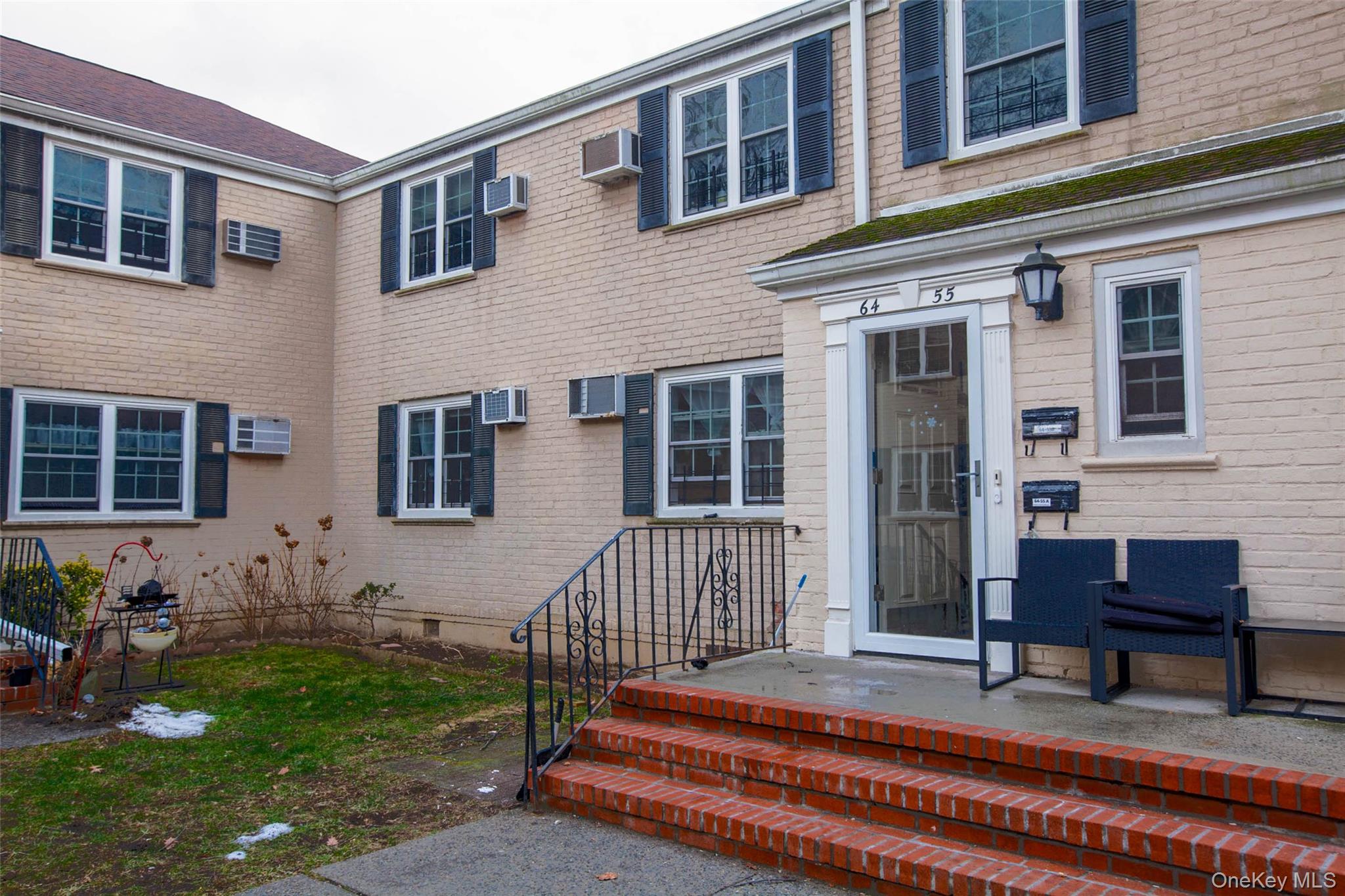 64-55 Springfield Boulevard, Unit 6455 Queens, NY 11364 - Photo 13 of 14 a front view of a house with outdoor seating