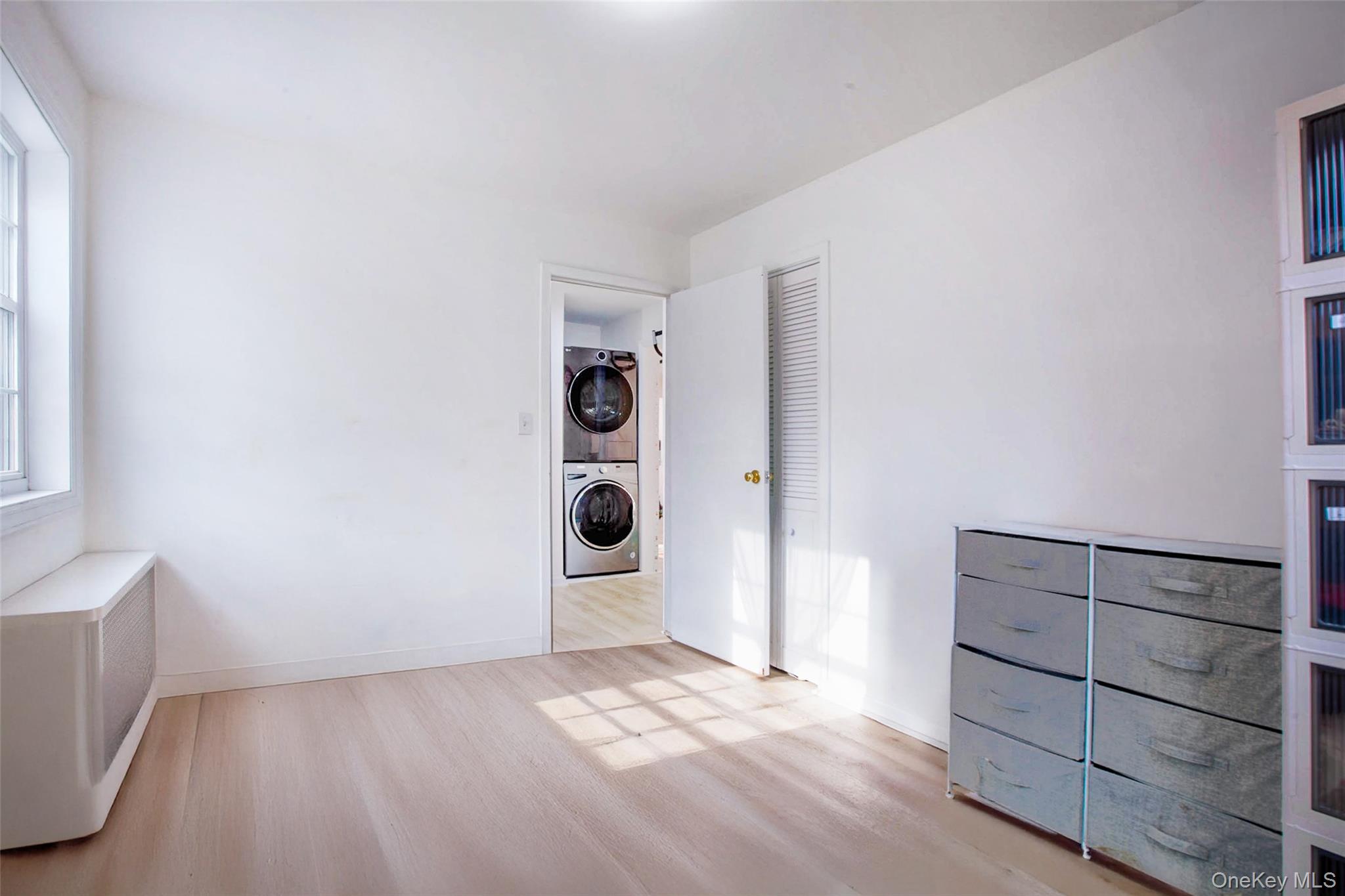 64-55 Springfield Boulevard, Unit 6455 Queens, NY 11364 - Photo 10 of 14 a view of an empty room with a window