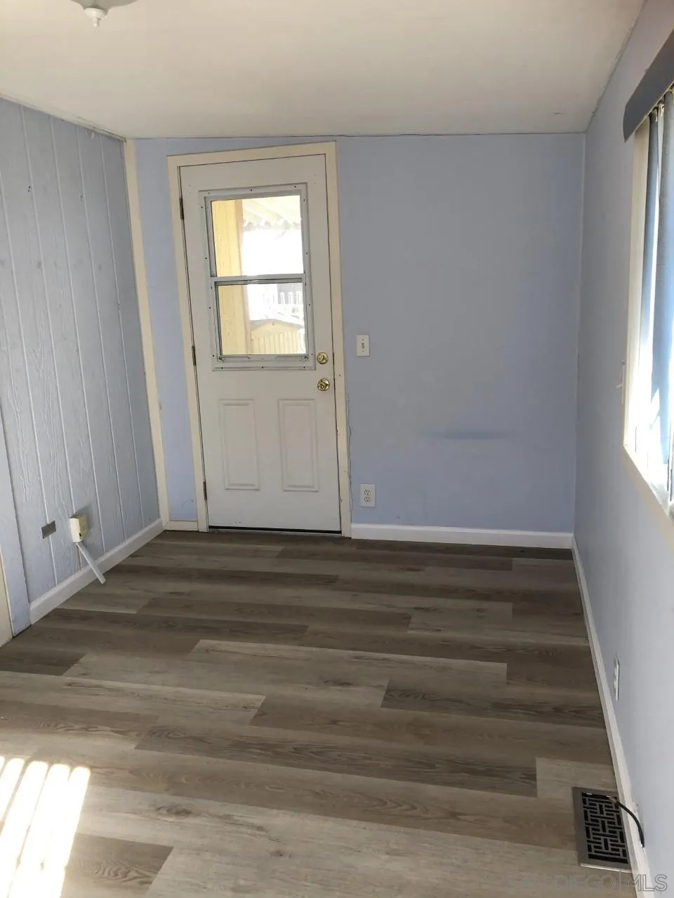 9459 Mission Gorge Road, Unit 13 Santee, CA 92071 - Photo 11 of 11 a view of empty room with wooden floor and fan
