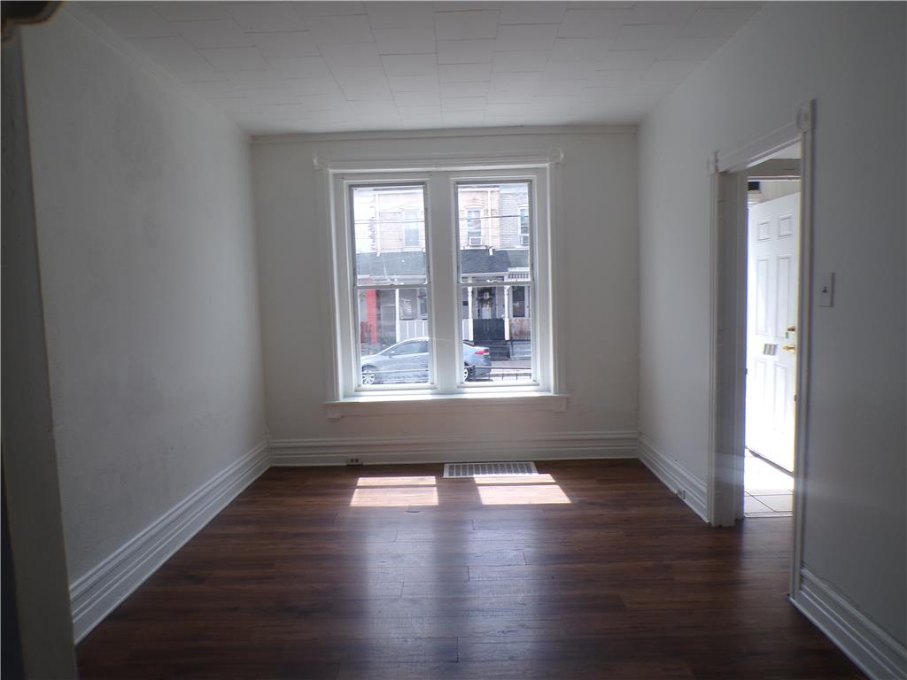 111 Ridge Avenue Allentown, PA 18102 - Photo 3 of 15 Sun-filled room boasts rich wood flooring and classic trim.