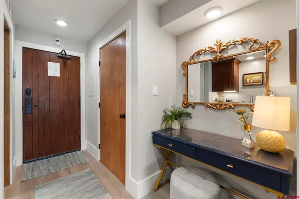 a room with furniture and wooden floor