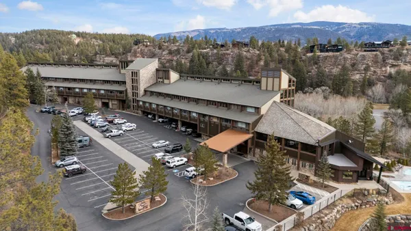 an aerial view of a house with roof deck