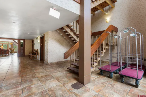 a view of a hallway with windows