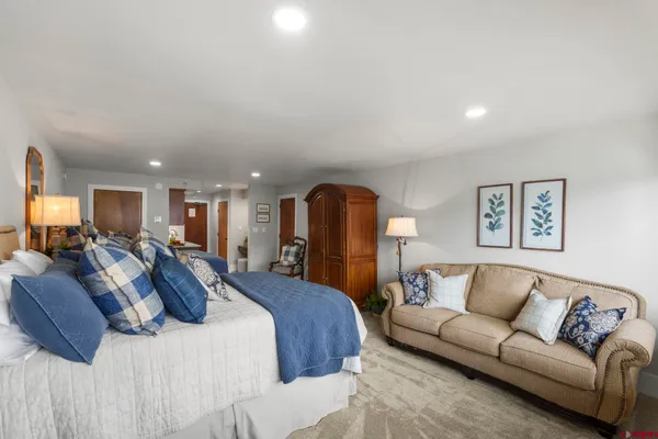 a bed room with a bed and a couch