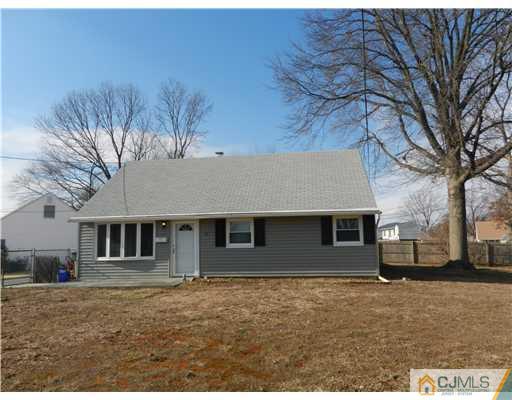17 Ashley Road Edison, NJ 08817 - Photo 1 of 20 a house that has a tree in front of it