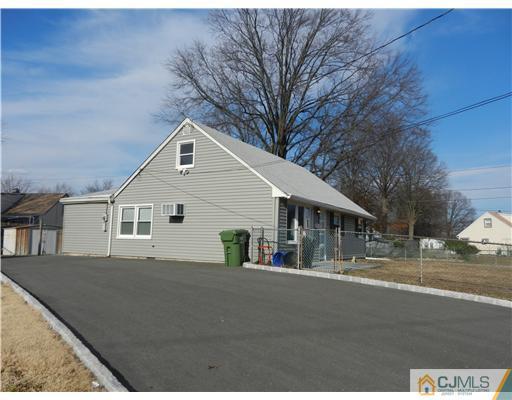 17 Ashley Road Edison, NJ 08817 - Photo 2 of 20 a front view of a house with a yard