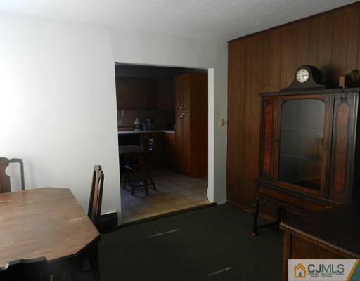 17 Ashley Road Edison, NJ 08817 - Photo 12 of 20 a close view of a sink a table and chairs in a room