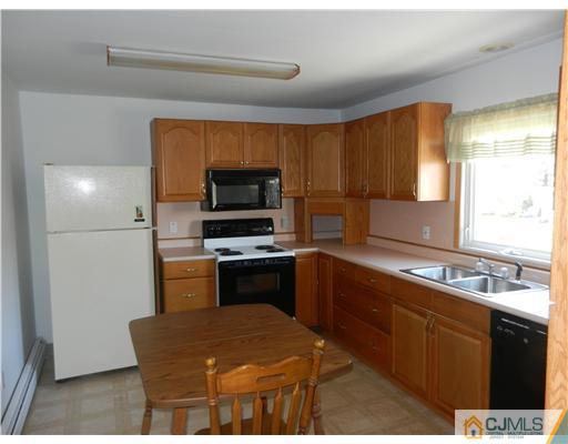 17 Ashley Road Edison, NJ 08817 - Photo 14 of 20 a kitchen with granite countertop a sink stainless steel appliances and cabinets