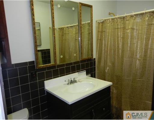 17 Ashley Road Edison, NJ 08817 - Photo 17 of 20 a bathroom with a sink and a mirror