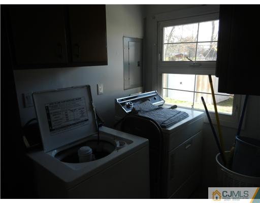 17 Ashley Road Edison, NJ 08817 - Photo 19 of 20 a kitchen with a sink stove and cabinets