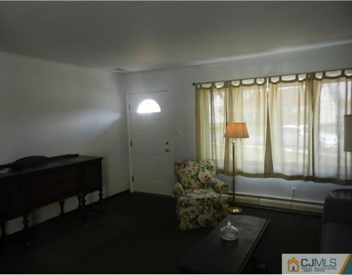 17 Ashley Road Edison, NJ 08817 - Photo 9 of 20 a room with furniture and a window