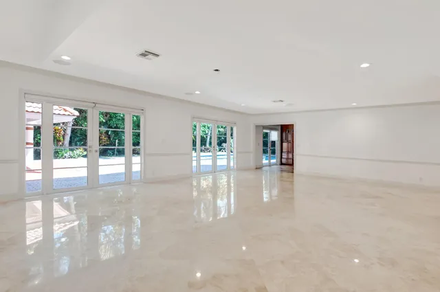 a kitchen with stainless steel appliances granite countertop a stove top oven a sink and dishwasher